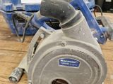 a close up of a circular saw on a table in a store
