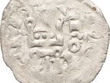 a close up of a coin with a face on it