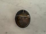a picture of a button on a marble surface