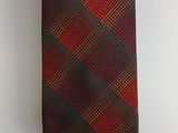 an image of a red and brown tie hanging on a wall