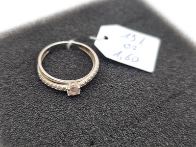a ring that is sitting on top of a black cloth