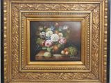 painting of a still life of flowers and fruit in a gold frame