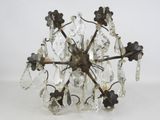 an image of a chandelier made of glass hanging from a ceiling