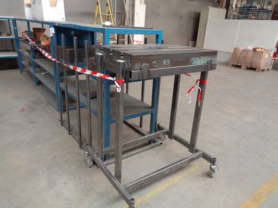 an image of a conveyor belt in a factory with boxes in the background