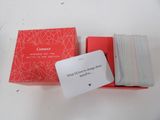 a red box with a card on it and a red box with a card on it