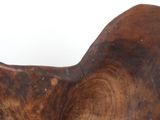 a large piece of wood sitting on a white surface