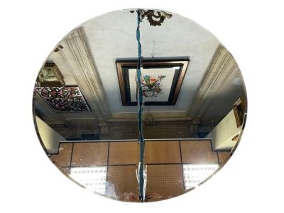 a picture of a mirror hanging on the wall in a room