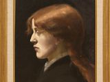 portrait d'une femme aux cheveux roux dans un cadre doré