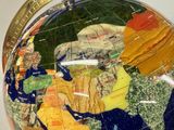 a close up of a glass globe with a map on it