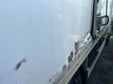 a white truck that is parked on the side of the road