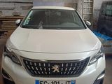 a white car that is parked in a garage