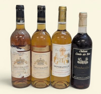trois bouteilles de vin posées les unes à côté des autres sur une surface blanche