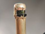 a bottle of wine that has a cork on it