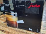 a box of coffee sitting on a table in a store