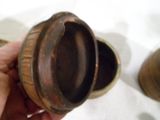 a person holding a small metal object in their hand