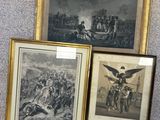 three framed pictures of soldiers and a horse drawn carriage on a carpet