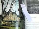 an open book with a picture of a castle in it