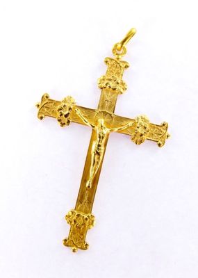 a gold cross on a white background