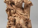 statue of a woman holding a child and a dog