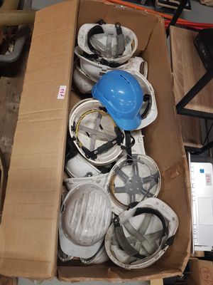 a box full of helmets and a hard hat in it
