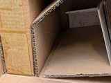 a cardboard box that is open to show the inside of it