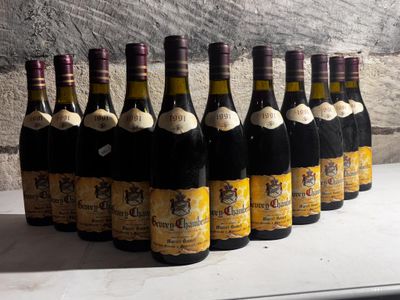 many bottles of wine lined up on a table
