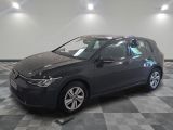 the volkswagen golf is parked in a garage with a checkered floor