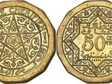 a gold coin with a design on it