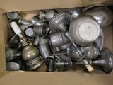 a cardboard box filled with many different types of pots and pans