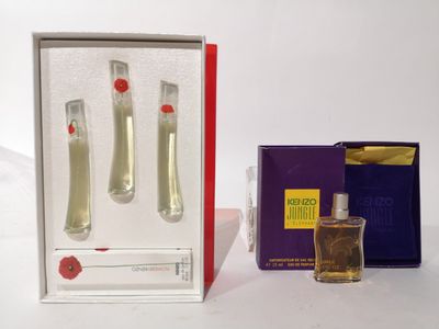 un flacon de parfum à côté d'un coffret de parfum