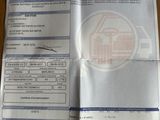 une photo d'un ticket de caisse sur lequel figure l'image d'une maison