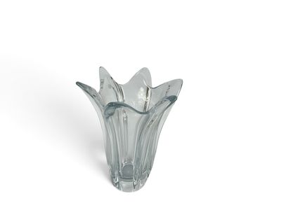a glass vase that has a spoon and spoon in it