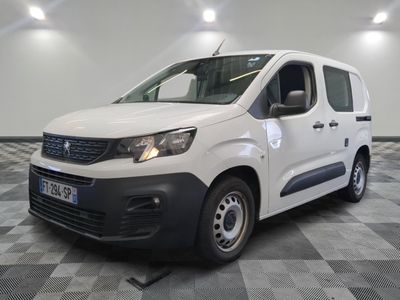 the white van is parked on a checkered floor in a room