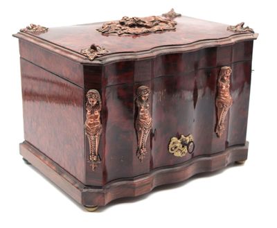 a wooden box with carvings on it on a white background