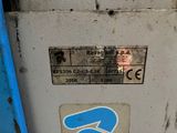 a sticker on the side of a machine that has a blue arrow on it