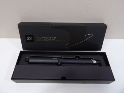 a black box with a black pen inside of it