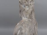 an image of a stone statue of a man with his head turned to the side