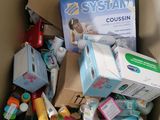 a cardboard box full of baby products and other items
