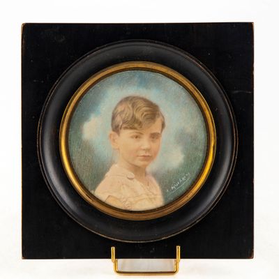 portrait of a young boy in a black frame on a white background