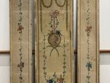 two antique wooden doors with floral designs on them in a room
