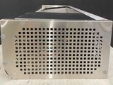 a metal box with holes on it sitting on a table
