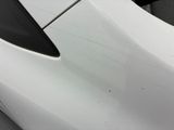 a close up of a white car with black trims