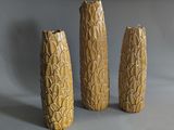 three vases that are sitting on a table