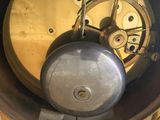 a close up of a clock that is on a table
