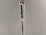 a toothbrush in a plastic bag on a table