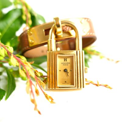 an image of a close up of a wrist watch with a lock