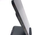 a close up of a cell phone on a stand
