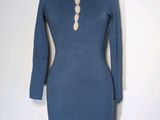 the dress is blue and has buttons on the neck