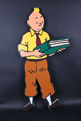 cartoon of a man holding a book and a book in his hand
