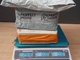 a stack of food sitting on top of a scale on a table